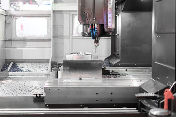 High precision CNC machining center working, operator machining