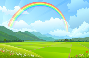 Rainbow over the mountains, hills and rice fields