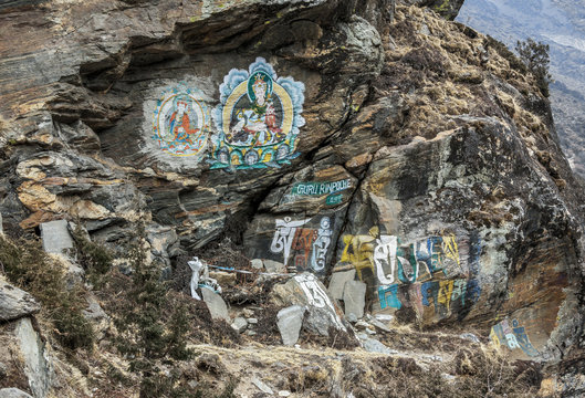 The ancient image of guru Rinpoche on a rock near village Shomare in the valley of Chukung district Everest - Nepal, Himalayas