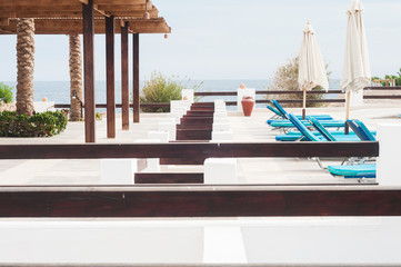 Swimming pool with stair in hotel. Summer photo concept.