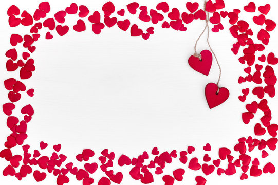 Valentines Day background with red hearts. Border, copy space