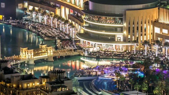 A general view of the bridge over man-made lake timelapse in Dubai downtown, United Arab Emirates. 