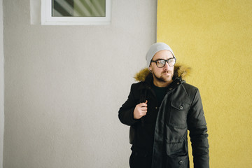 Happy young man with beard.