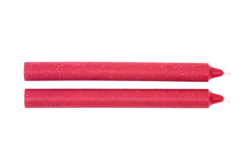 Red natural candle isolated on white background