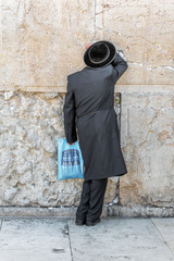 JERUSALEM, ISRAEL - MAY 26: Jews pray at the holy site. The Western Wall is the most sacred sites in Judaism, it attracts thousands of devotees every day, on May 26, 2013 in Jerusalem