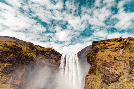 Clouds above waterfall