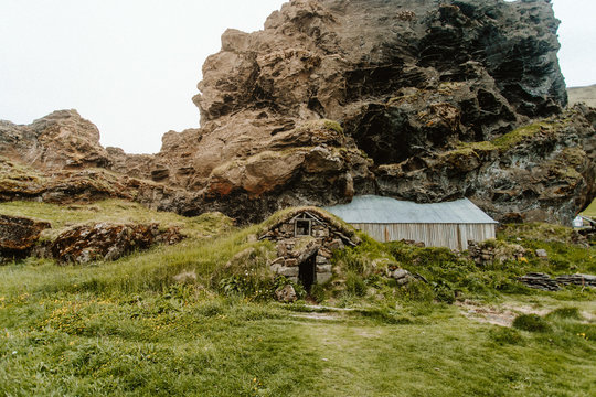 Hut under rock formation