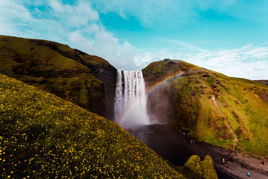 Scenic view of waterfall and rainbow