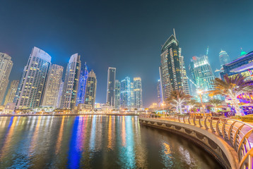 Dubai Marina night skyline along artificial canal, UAE