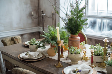 Festive winter still life. Table setting in rustic style, indoor