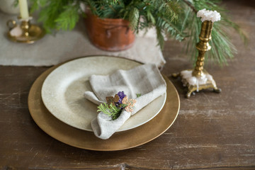Festive winter table setting in rustic style, indoor