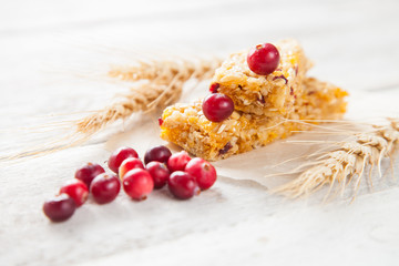 muesli bars , cereals and berries on a table, selective focus, copy space