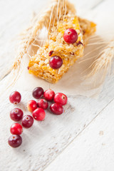 muesli bars , cereals and berries on a table, selective focus, copy space