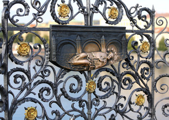 antique metal statue of St. John Nepomucene lying on the Charles