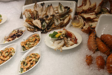 fish in pan for sale in self-service restaurant