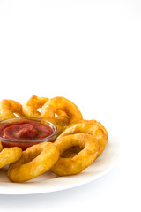 Fried calamari rings with and ketchup isolated on white background
