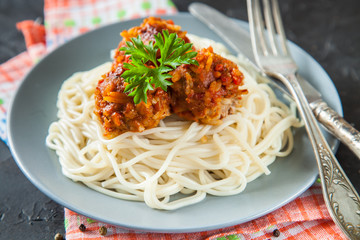 paste with meat meatballs in a plate on a table, selective focus, copy space