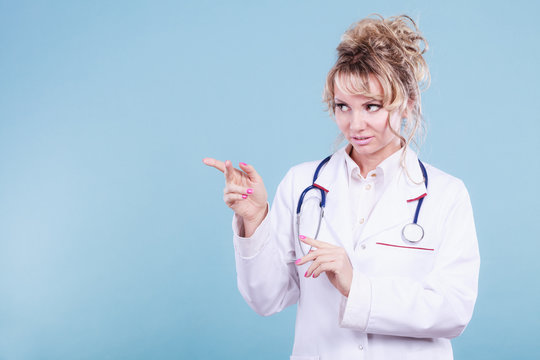 Female doctor showing copy space.