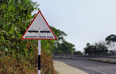 Road sign warning motorists to be careful at a zone prone to possible accidents and collisions in a hill highway