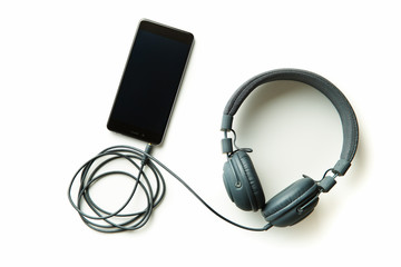 Fototapeta premium Gray vintage headphones and cellphone.