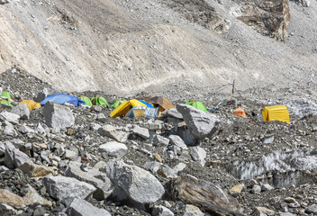Tents climbers are on the Khumbu glacier near legendary place Everest Base Camp - Nepal, Himalayas