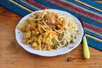 Plate of Rice, Potatoes, Noodles and Chicken
