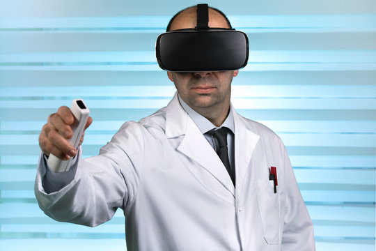 Researcher Wearing Virtual Reality Glasses Conducting A Work Remote / Doctor In Virtual Medical Tour With VR Virtual Reality Glasses