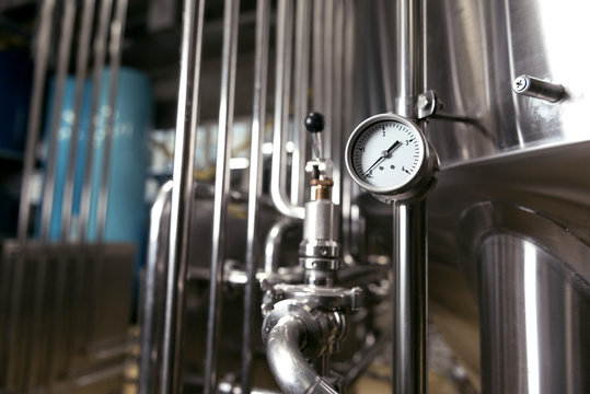 Measuring gauge being used in brewery