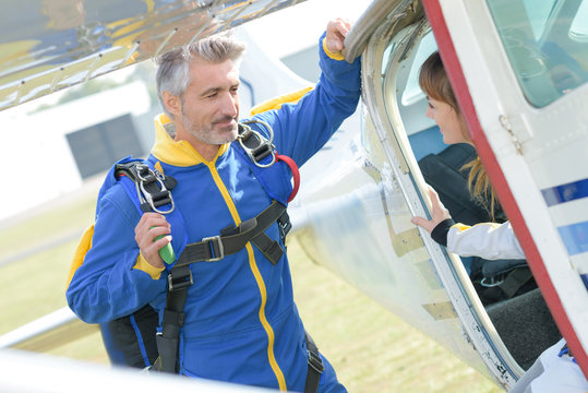 skydiver talking to a client