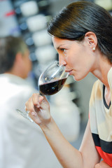 Woman drinking a glass of red wine