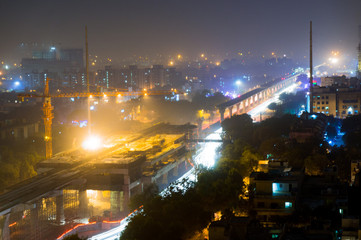 Construction of the Delhi metro Noida extension at night. The traffic flow is only lighly disturbed...