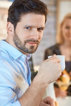 Closeup portrait of man with coffee
