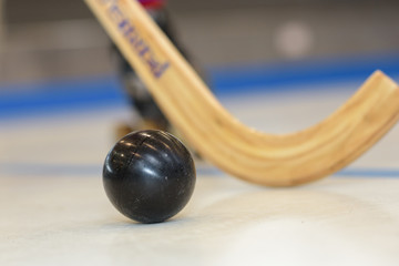Closeup of hockey stick and ball
