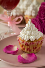 Sweet romantic cupcakes for Valentine's Day on a white wooden background. Selective focus