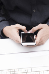 closeup of hands with the phone on your desktop
