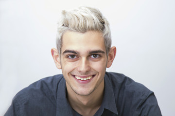 portrait of a modern young man with the white hair, isolated on white background