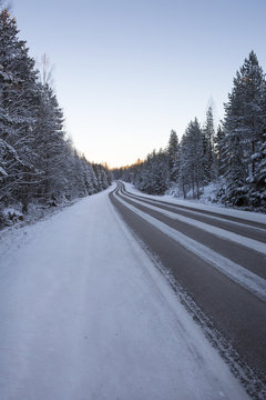 Traveling early in the morning. Image taken during sunrise on a cold winter morning in Finland.