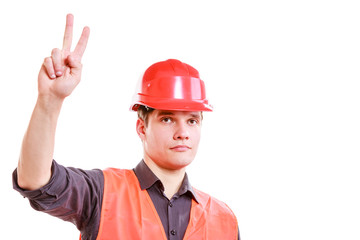 Man worker showing sign of victory.