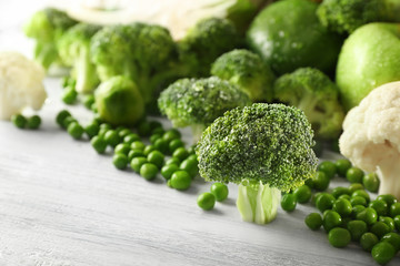 Green vegetables on wooden background