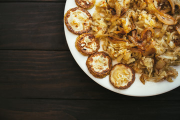 Fried grated potatoes with fried zucchini