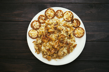 Fried grated potatoes with fried zucchini