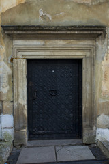 Fototapeta na wymiar Wrought iron black door with a pattern in Lviv