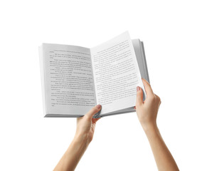 Female hands holding opened book on white background
