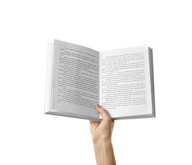 Female hand holding opened book on white background