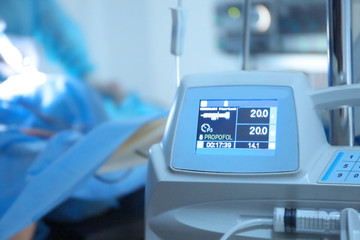 Controlled syringe pump in modern clinic, closeup