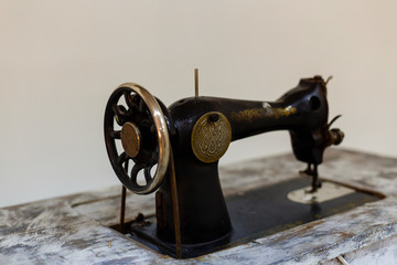 The old sewing machine on a white background