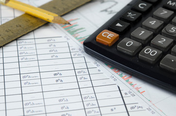 Financial records, calculator and pencil
