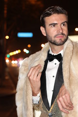 Snob man in sparkly golden tuxedo