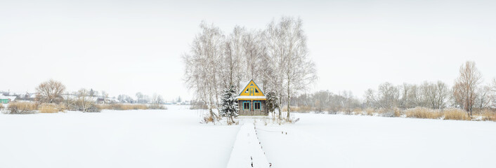 panorama with little farm house in winter time