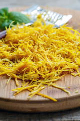 Lemon zest grated close up.